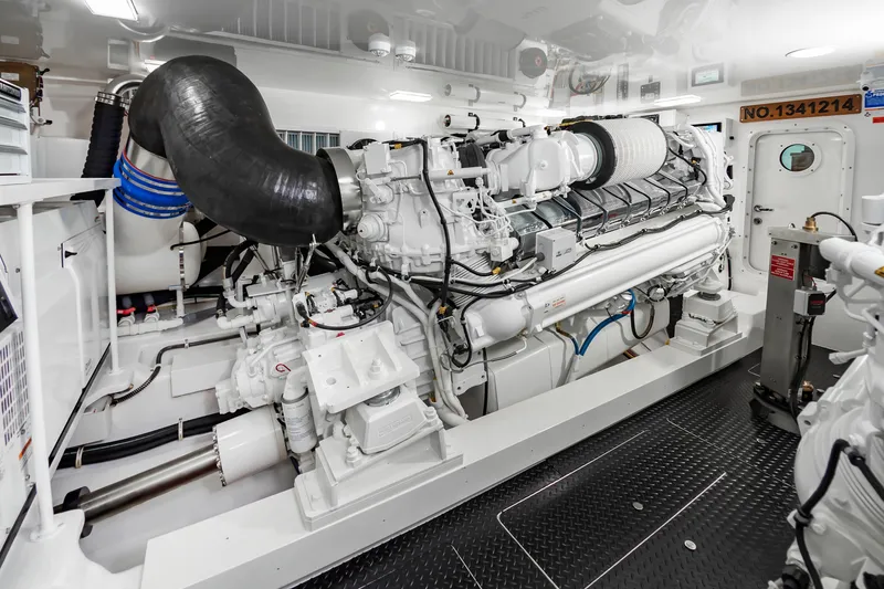 Slide: The Image of Engine room of 2024 Viking 72 Convertible yacht, showcasing advanced machinery and clean design. - 102