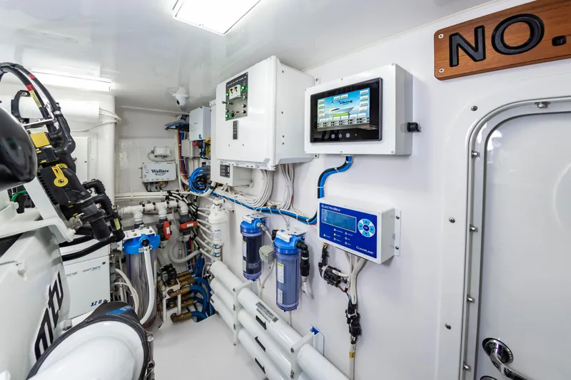 Slide: The Image of Engine room of 2024 Viking 72 Convertible yacht with advanced control systems. - 105