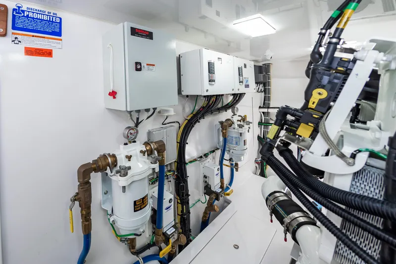 Slide: The Image of Engine room of 2024 Viking 72 Convertible yacht with advanced control systems. - 106