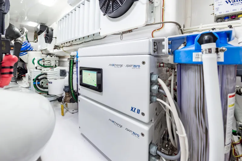 Slide: The Image of Engine room of 2024 Viking 72 Convertible yacht with advanced water purification system. - 107