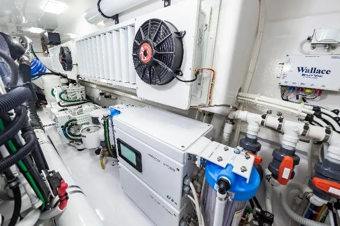 Slide: The Image of Engine room of 2024 Viking 72 Convertible yacht, showcasing advanced machinery and systems. - 110