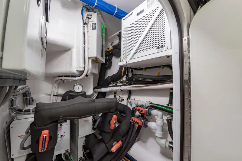 Slide: The Image of Engine room of 2024 Viking 72 Convertible yacht with advanced mechanical systems. - 114