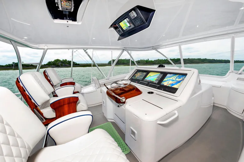 Slide: The Image of Luxurious helm of 2024 Viking 72 Convertible yacht with advanced navigation displays. - 26
