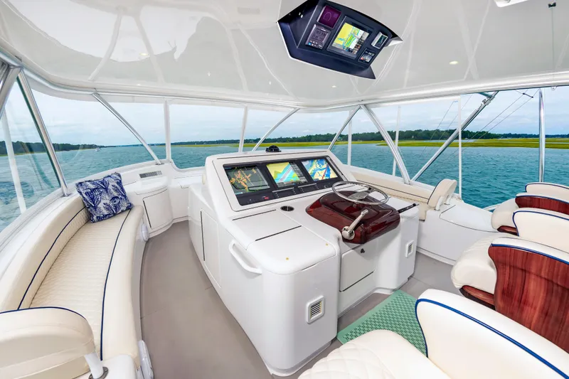 Slide: The Image of Luxurious interior of 2024 Viking 72 Convertible yacht with advanced navigation systems. - 27