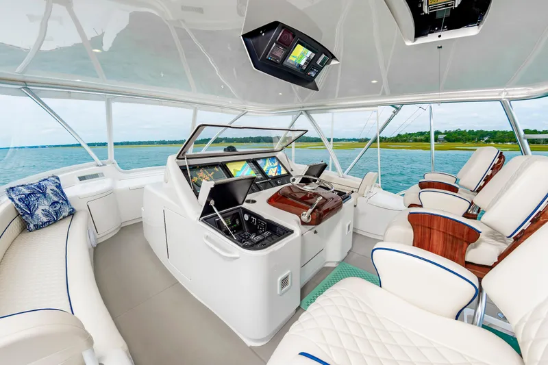 Slide: The Image of Luxurious interior of 2024 Viking 72 Convertible yacht with advanced navigation systems. - 28