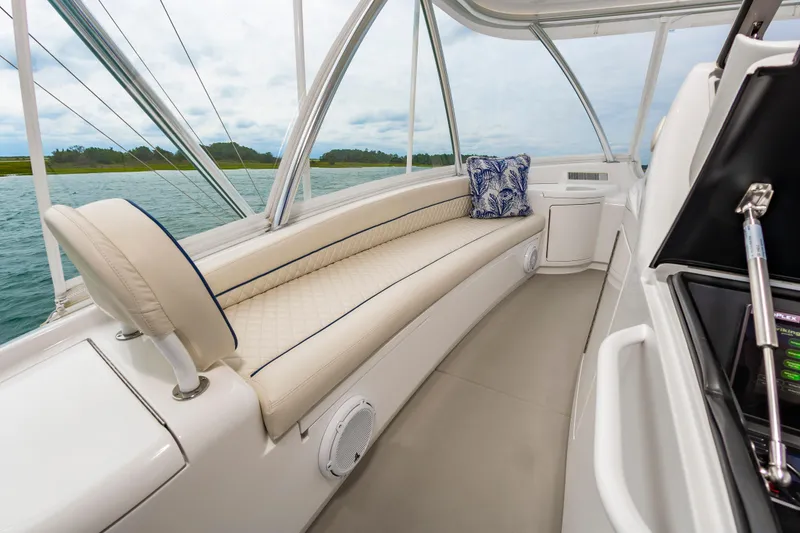 Slide: The Image of Luxurious interior of 2024 Viking 72 Convertible yacht with plush seating and scenic views. - 32