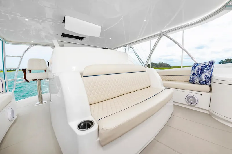 Slide: The Image of Luxurious interior of 2024 Viking 72 Convertible yacht with plush seating and ocean view. - 35
