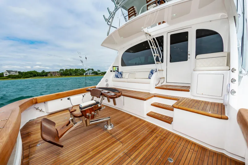 Slide: The Image of 2024 Viking 72 Convertible yacht deck with seating and fishing chair. - 43