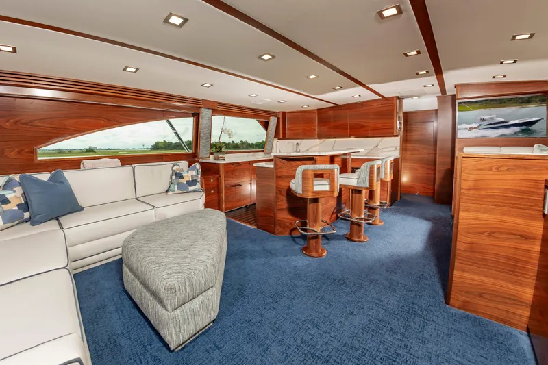 Slide: The Image of Luxurious interior of 2024 Viking 72 Convertible yacht with elegant wood finishes. - 45