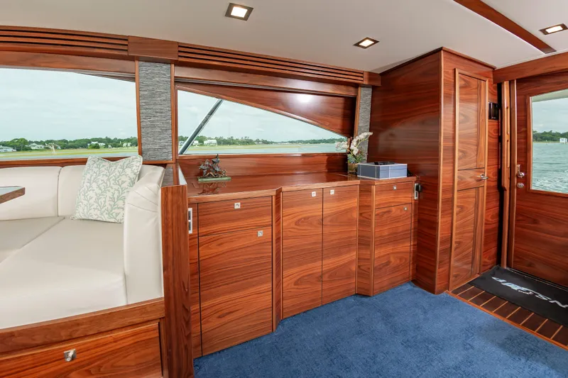 Slide: The Image of Luxurious interior of 2024 Viking 72 Convertible yacht with elegant wood finish. - 49