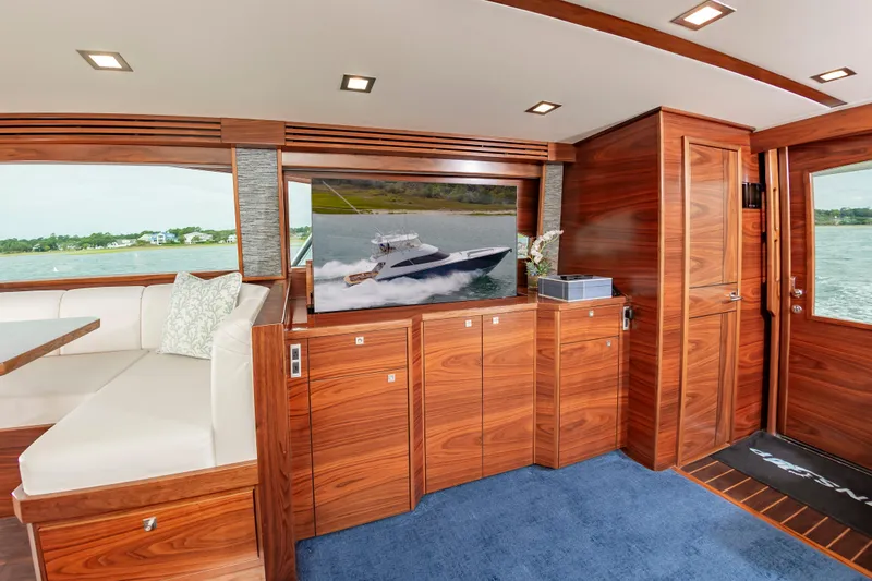 Slide: The Image of Luxurious interior of 2024 Viking 72 Convertible yacht with elegant wood finish and scenic views. - 50