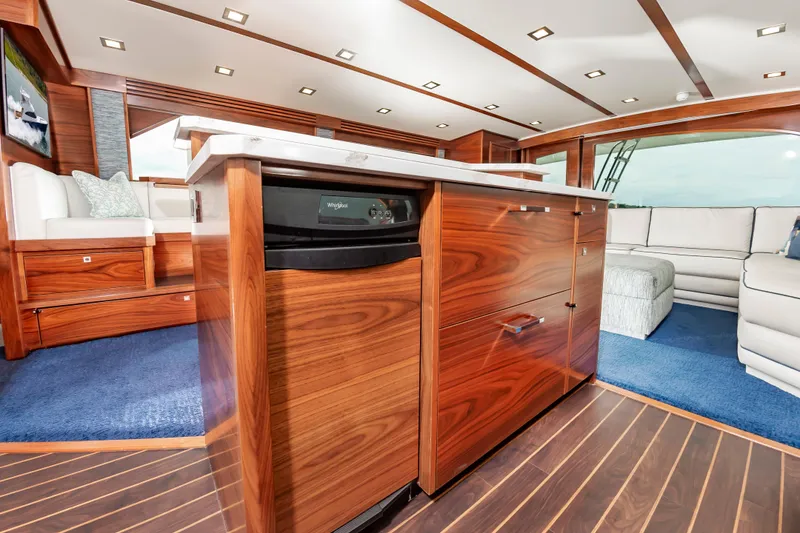 Slide: The Image of Luxurious interior of 2024 Viking 72 Convertible yacht with elegant wood finishes. - 61