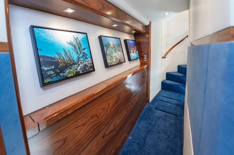 Slide: The Image of Luxurious interior of 2024 Viking 72 Convertible yacht with ocean-themed artwork. - 67