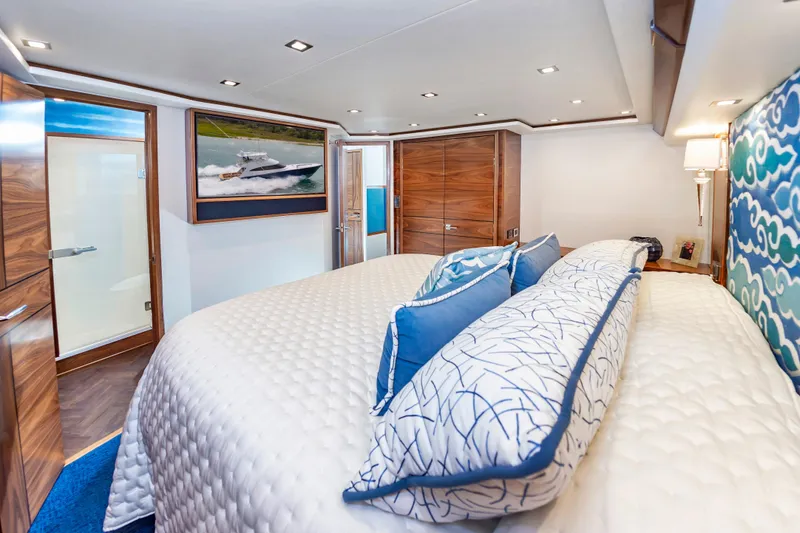Slide: The Image of Luxurious bedroom interior of 2024 Viking 72 Convertible yacht with elegant decor and modern amenities. - 68