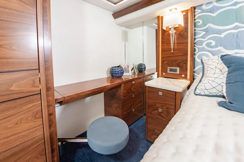 Slide: The Image of Luxurious cabin interior of 2024 Viking 72 Convertible yacht with elegant wood finish. - 70