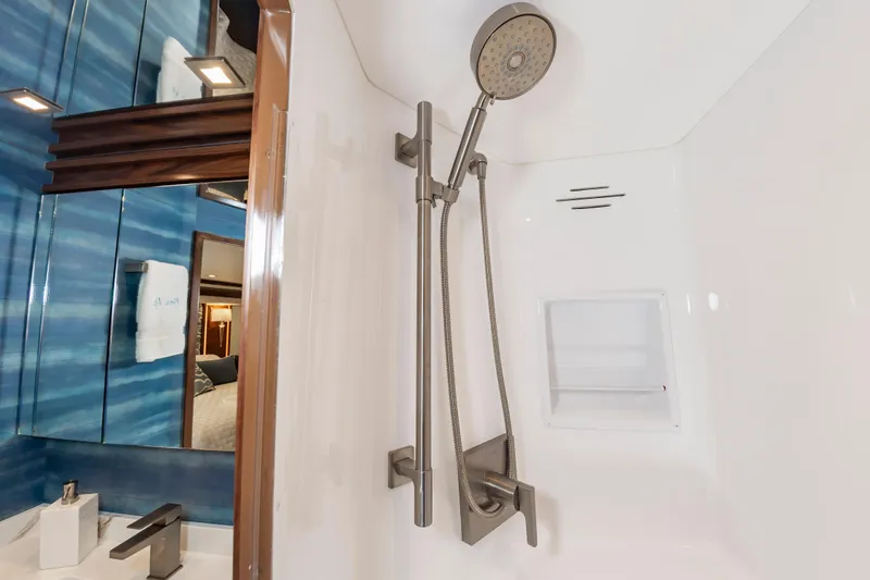 Slide: The Image of Luxurious shower in 2024 Viking 72 Convertible yacht bathroom. - 76
