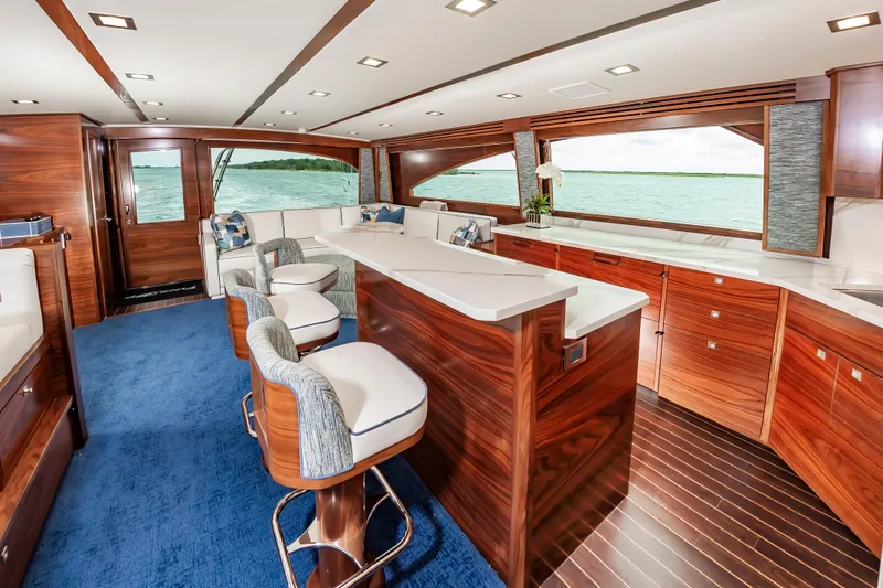 Slide: The Image of Luxurious interior of 2024 Viking 72 Convertible yacht with elegant wood finishes and ocean view. - 8