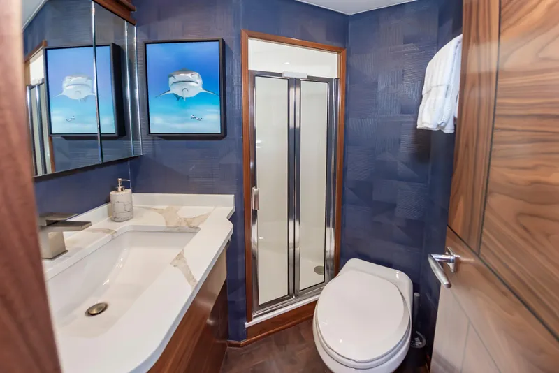 Slide: The Image of Luxurious bathroom in 2024 Viking 72 Convertible yacht with modern fixtures and elegant design. - 87