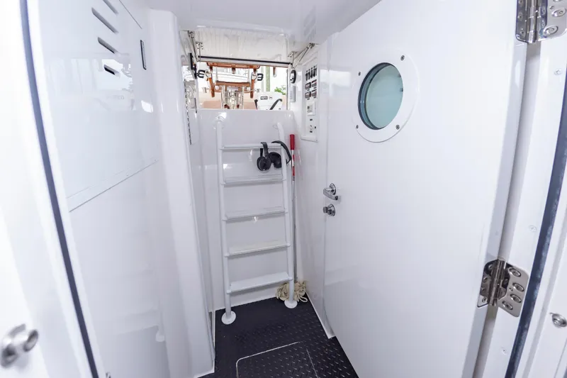 Slide: The Image of Interior of 2024 Viking 72 Convertible yacht with ladder and porthole. - 94