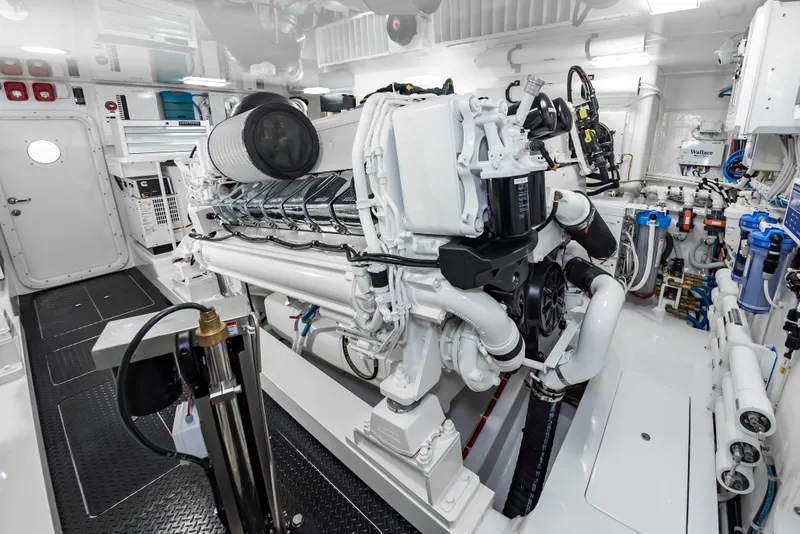 Slide: The Image of Engine room of 2024 Viking 72 Convertible yacht, showcasing advanced machinery and equipment. - 96