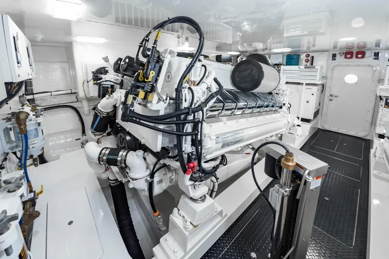 Slide: The Image of Engine room of 2024 Viking 72 Convertible yacht, showcasing advanced machinery and equipment. - 97