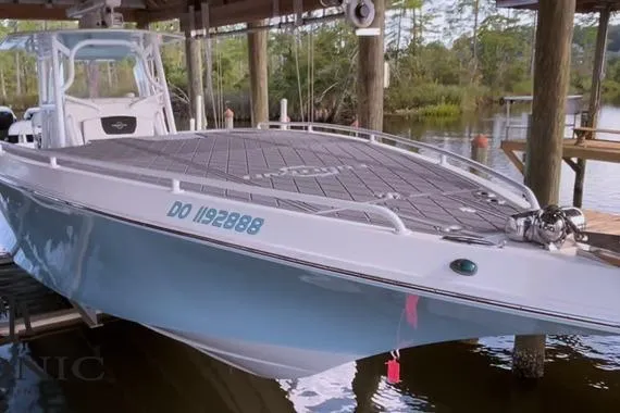 The Image of 2007 Fountain 38 CC Tournament Edition boat docked in a serene waterside setting. - 0