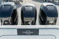 Slide: The Image of Three powerful outboard motors on a 2007 Fountain 38 CC Tournament Edition boat. - 10