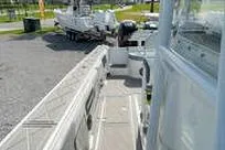 Slide: The Image of 2007 Fountain 38 CC Tournament Edition boat docked, showcasing deck and seating area. - 12