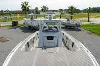 Slide: The Image of 2007 Fountain 38 CC Tournament Edition boat on display outdoors. - 17