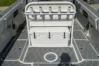 Slide: The Image of 2007 Fountain 38 CC Tournament Edition boat interior with rod holders and storage. - 27