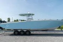 Slide: The Image of 2007 Fountain 38 CC Tournament Edition boat on trailer, side view. - 3