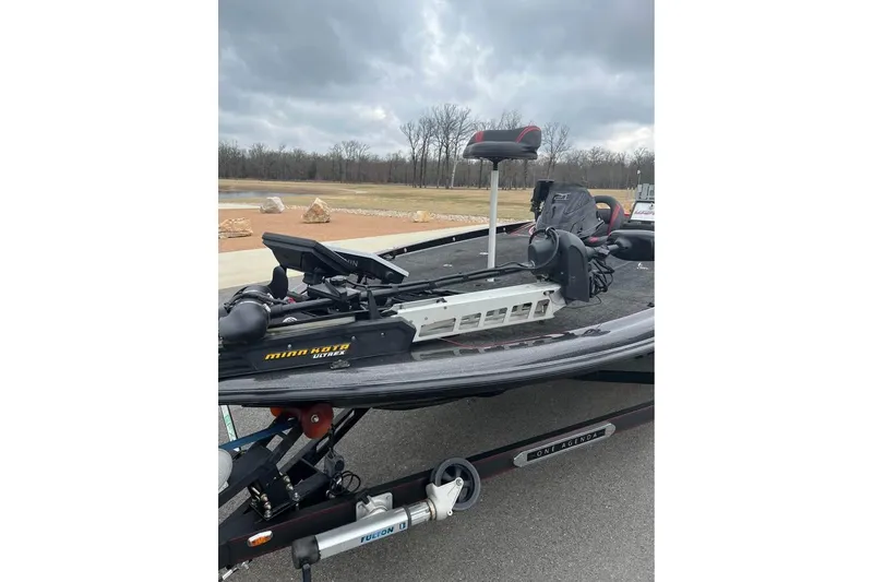 Slide: The Image of 2017 Legend Boats V21 with Minn Kota trolling motor on a trailer. - 2