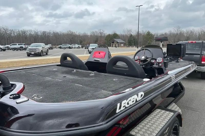 Slide: The Image of 2017 Legend Boats V21 in parking lot, showcasing sleek design and spacious deck. - 3