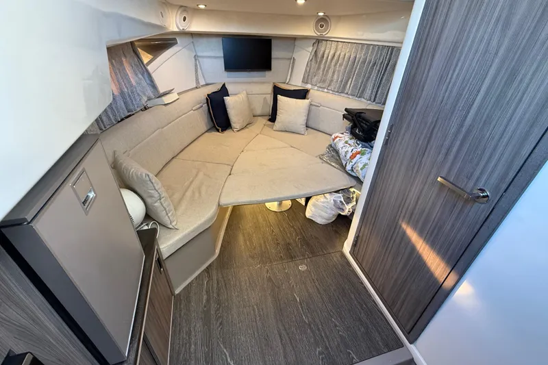 Slide: The Image of Interior of 2019 Sea Ray 320 Sundancer with cozy seating and modern design. - 16