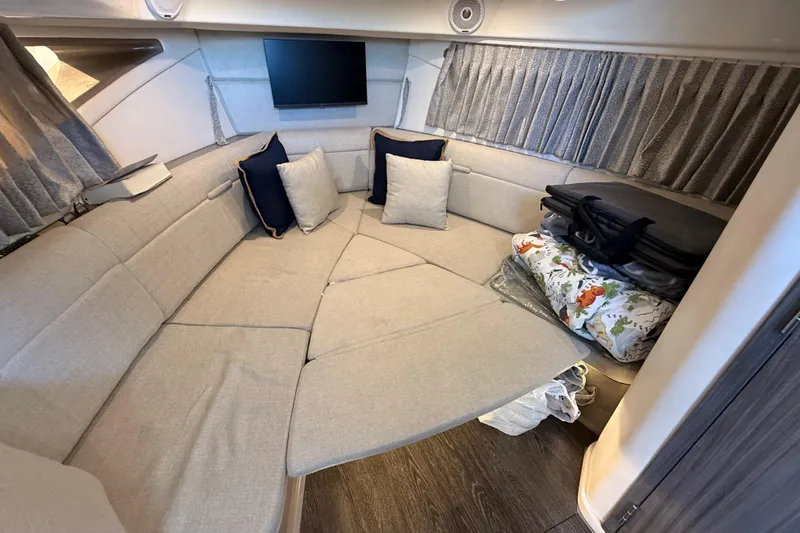 Slide: The Image of Interior of 2019 Sea Ray 320 Sundancer with cozy seating and modern decor. - 18