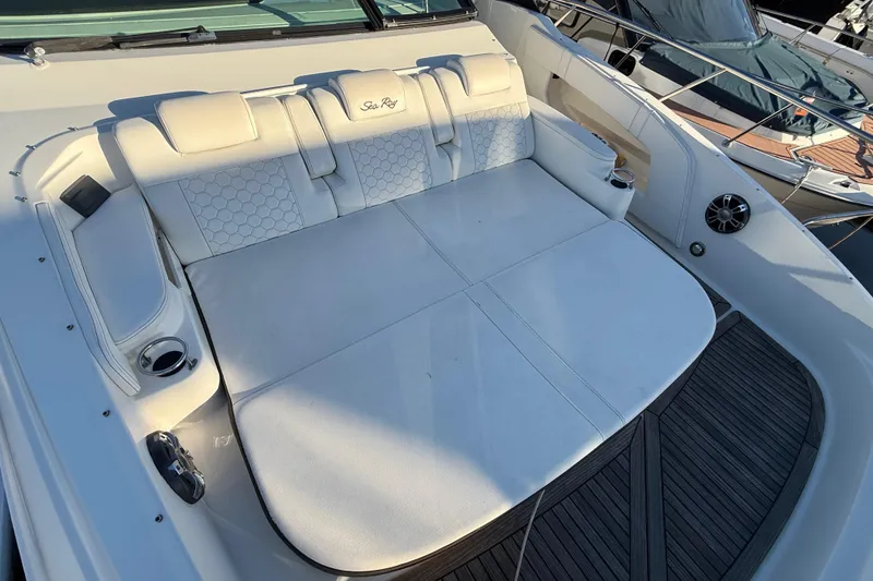 Slide: The Image of Luxurious seating area on a 2019 Sea Ray 320 Sundancer yacht, featuring white upholstery. - 6