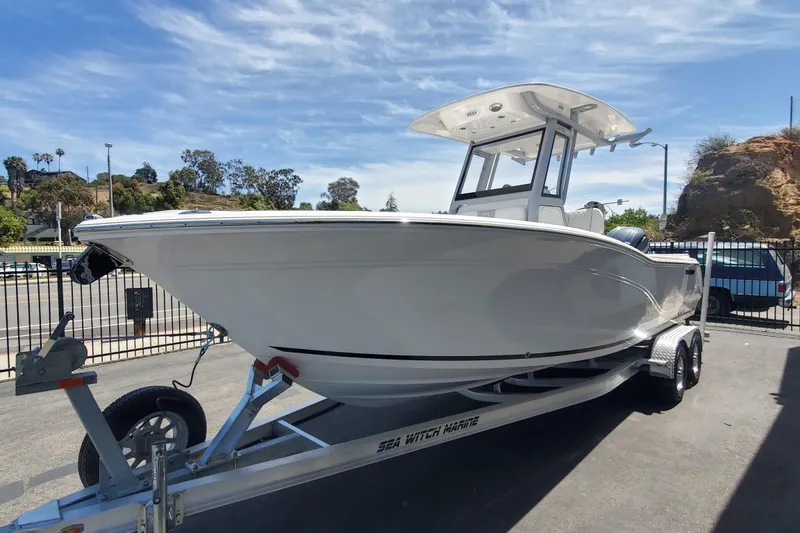 Slide: The Image of 2026 Sea Fox 248 Commander boat on trailer, parked outdoors under a clear sky. - 1