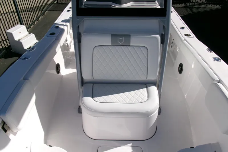 Slide: The Image of 2026 Sea Fox 248 Commander boat interior with white cushioned seating. - 11