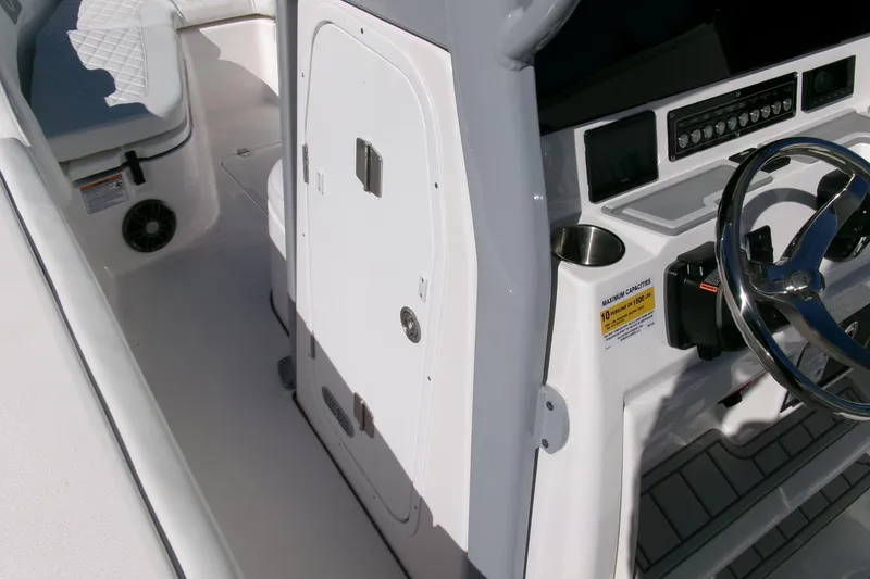 Slide: The Image of 2026 Sea Fox 248 Commander boat interior with steering wheel and seating area. - 14