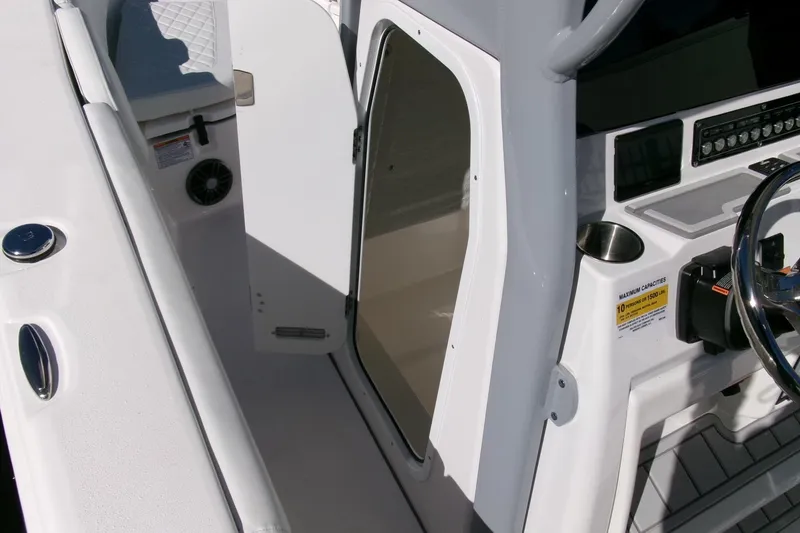 Slide: The Image of 2026 Sea Fox 248 Commander boat interior with helm and seating area. - 15