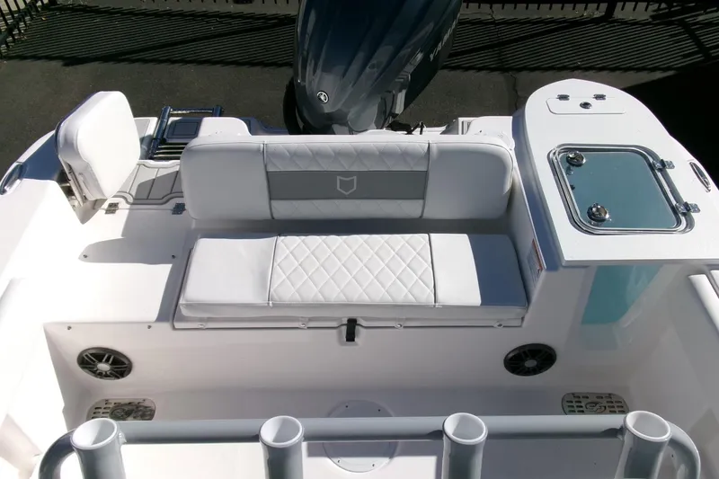 Slide: The Image of 2026 Sea Fox 248 Commander boat interior with cushioned seating and storage compartments. - 26