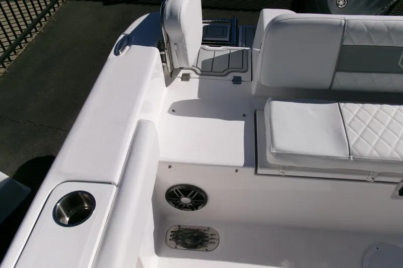 Slide: The Image of 2026 Sea Fox 248 Commander boat interior with white seating and cup holder. - 27