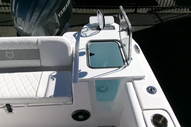 Slide: The Image of 2026 Sea Fox 248 Commander boat interior with Yamaha engine, featuring seating and storage. - 28