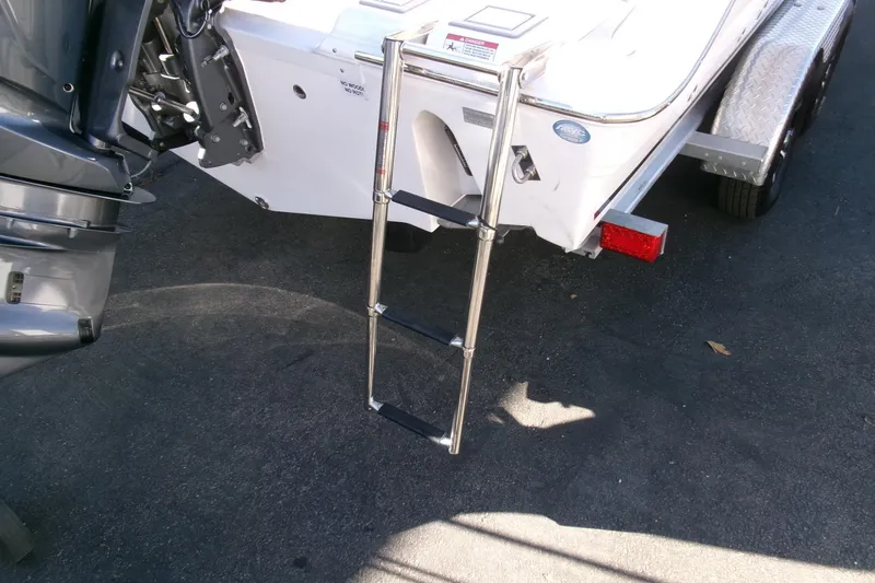 Slide: The Image of 2026 Sea Fox 248 Commander boat with ladder and outboard motor. - 33
