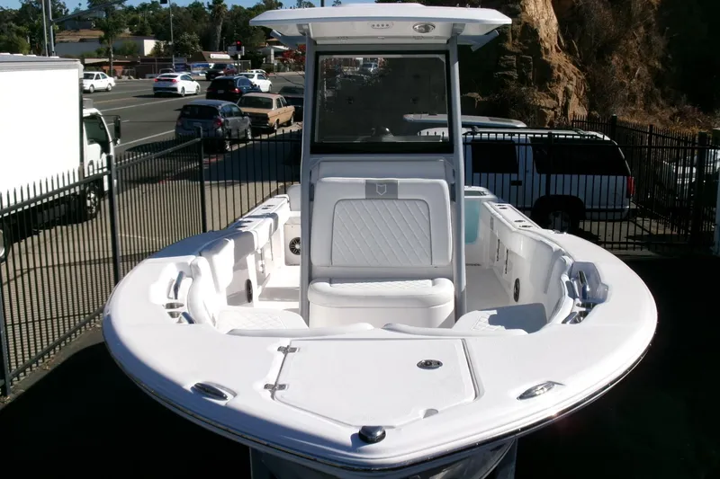 Slide: The Image of 2026 Sea Fox 248 Commander boat, white interior, parked outdoors near a road. - 35
