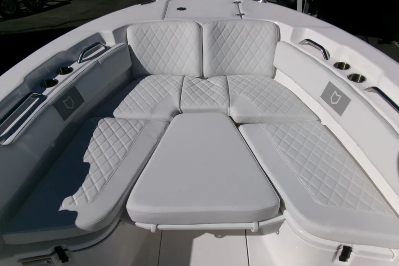 Slide: The Image of 2026 Sea Fox 248 Commander boat with luxurious white seating and cup holders. - 8