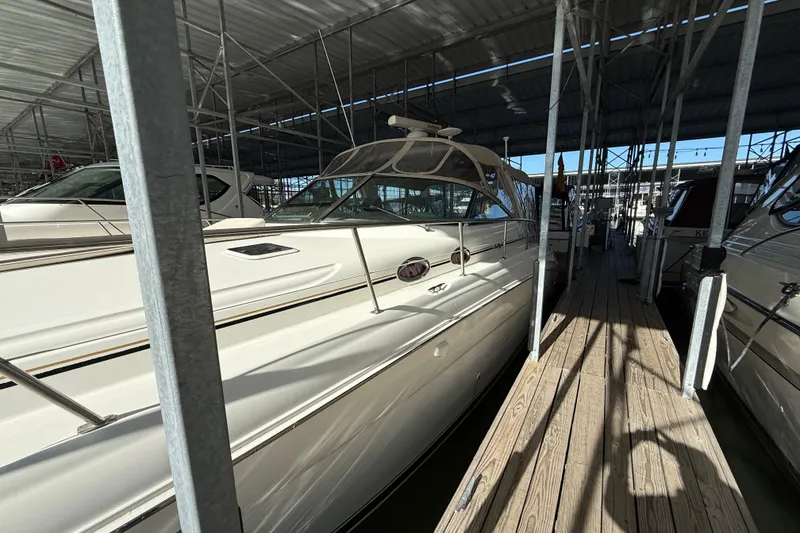 The Image of 2001 Sea Ray 380 Sundancer docked in a covered marina. - 0