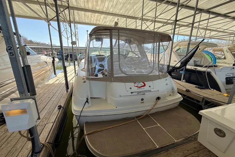 Slide: The Image of 2001 Sea Ray 380 Sundancer docked in a covered marina slip. - 3