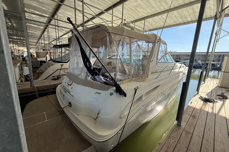 Slide: The Image of 2001 Sea Ray 380 Sundancer docked in a covered marina, side view. - 4