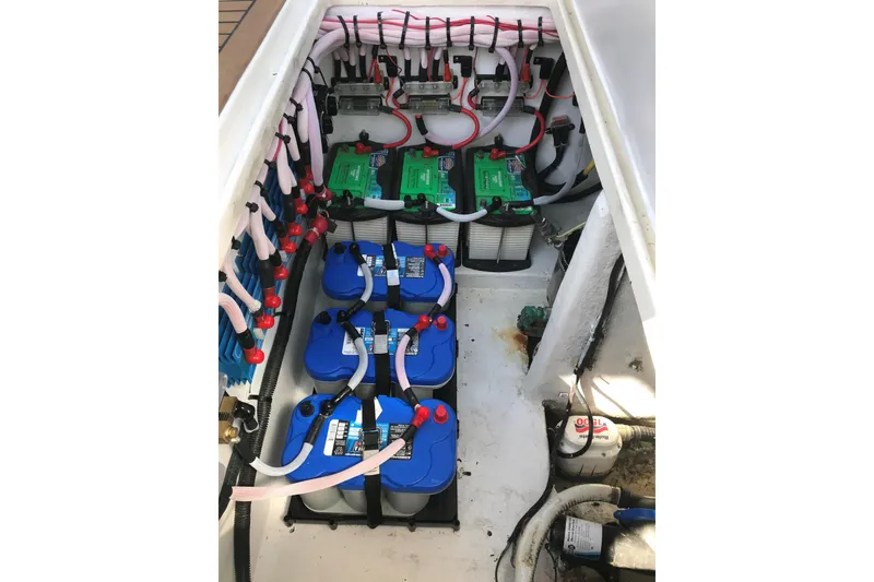 Slide: The Image of Battery compartment of 2007 Fountain 38 Sportfish Cruiser OB with organized wiring. - 18